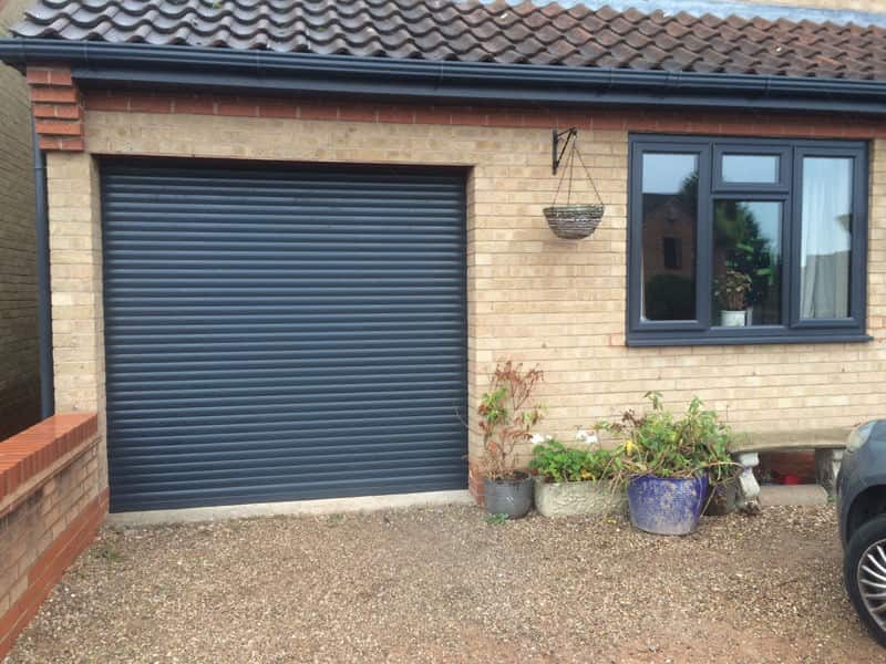 Single width black roller garage door