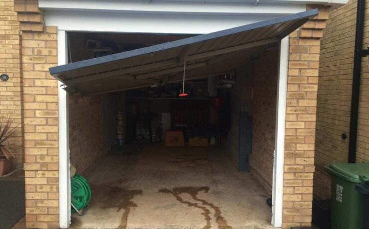 Broken garage door that is trying to be opened